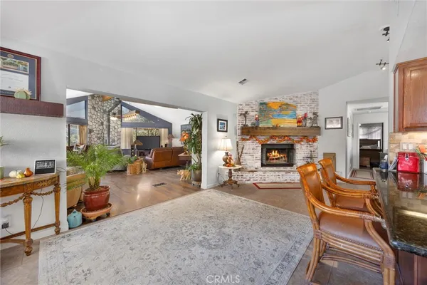 a living room with fireplace furniture and a flat screen tv