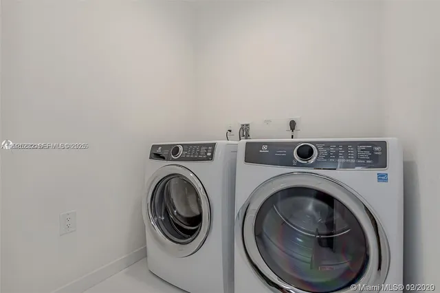 a bathroom with a sink toilet vanity and shower