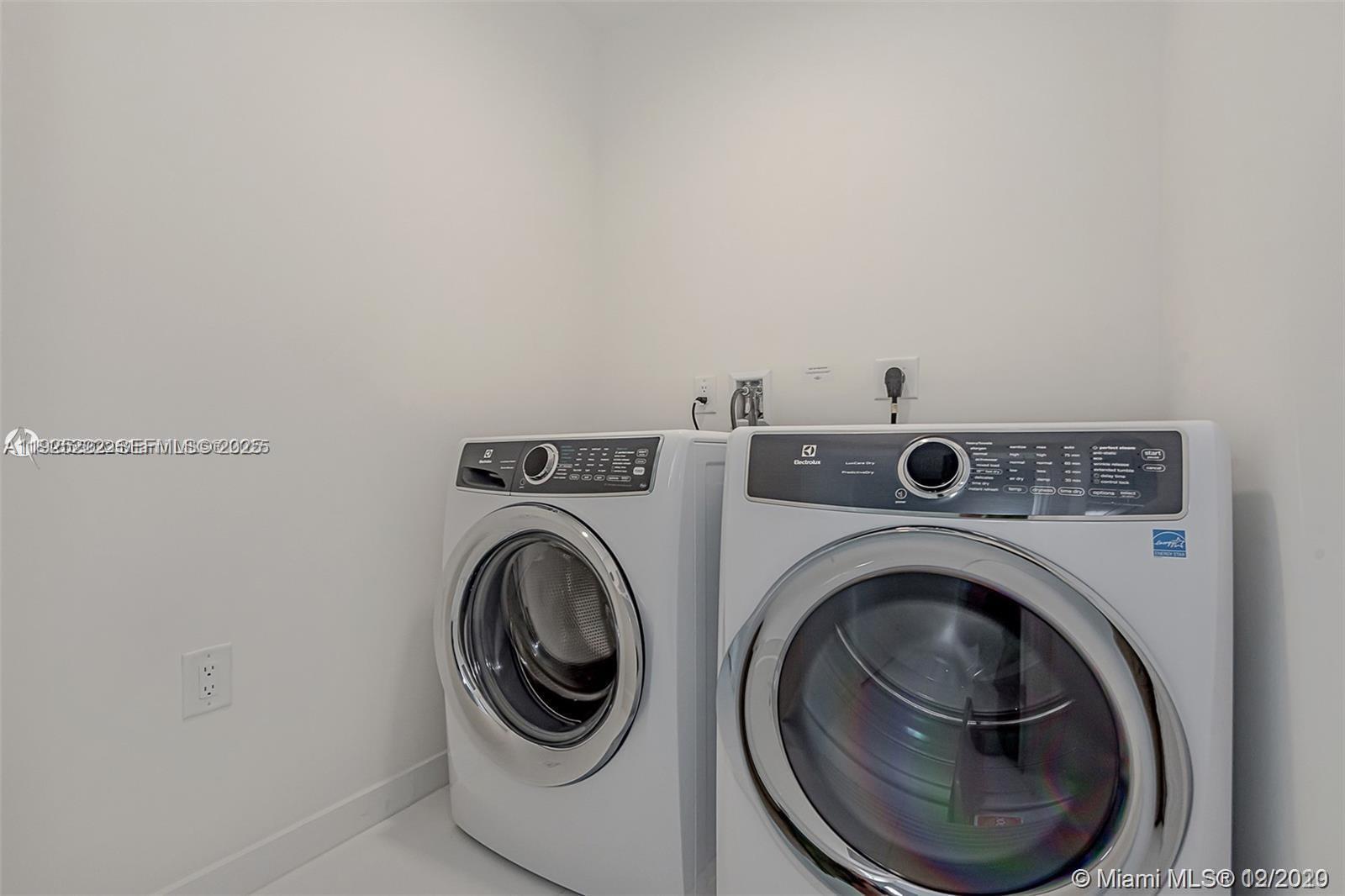 851 Northeast 1st Avenue, Unit 1608 Miami, FL 33132 - Photo 14 of 34 a utility room with dryer and washer