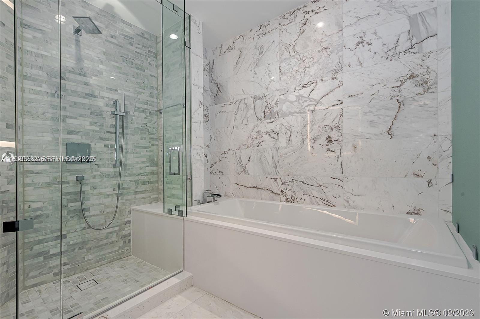 851 Northeast 1st Avenue, Unit 1608 Miami, FL 33132 - Photo 6 of 34 a bathroom with a bathtub