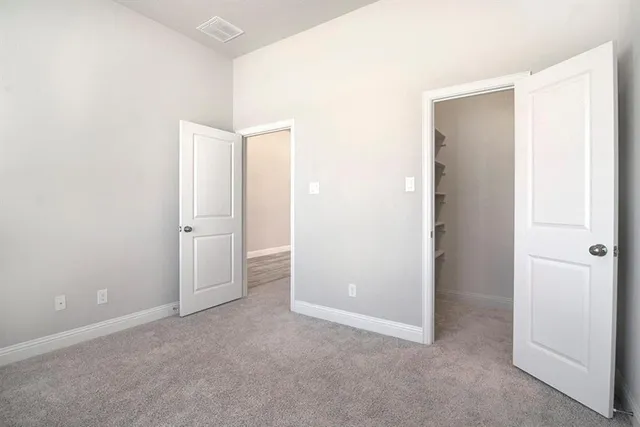 a kitchen with a sink a stove a microwave and cabinets