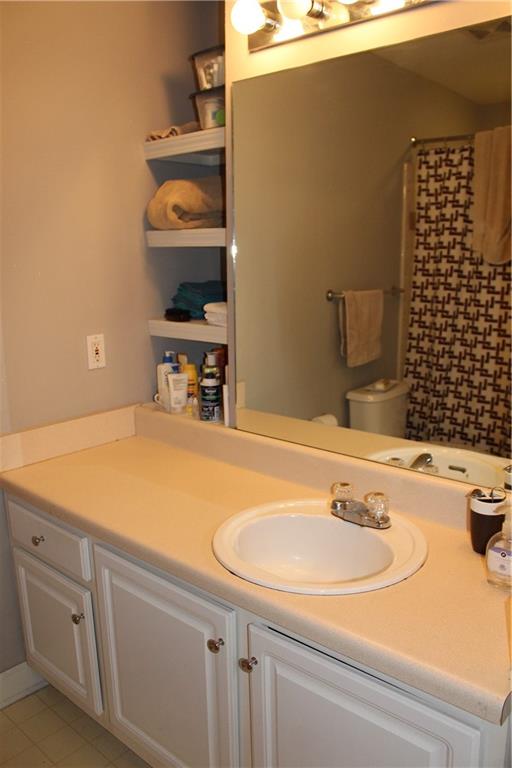 1101 Juniper Street Northeast, Unit 1416 Atlanta, GA 30309 - Photo 15 of 48 a bathroom with a sink and a mirror