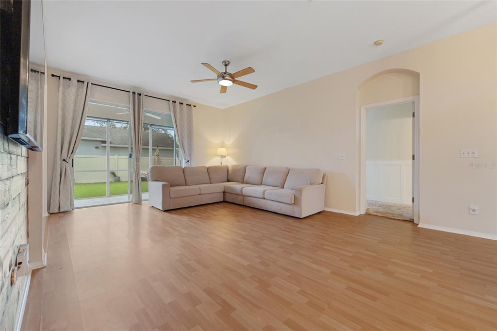 1073 Turtle Lake Court Ocoee, FL 34761 - Photo 19 of 46 a living room with furniture and a flat screen tv