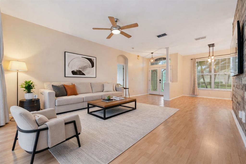 1073 Turtle Lake Court Ocoee, FL 34761 - Photo 20 of 46 a living room with furniture and a large window