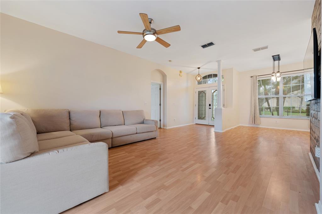 1073 Turtle Lake Court Ocoee, FL 34761 - Photo 21 of 46 a living room with furniture and a ceiling fan