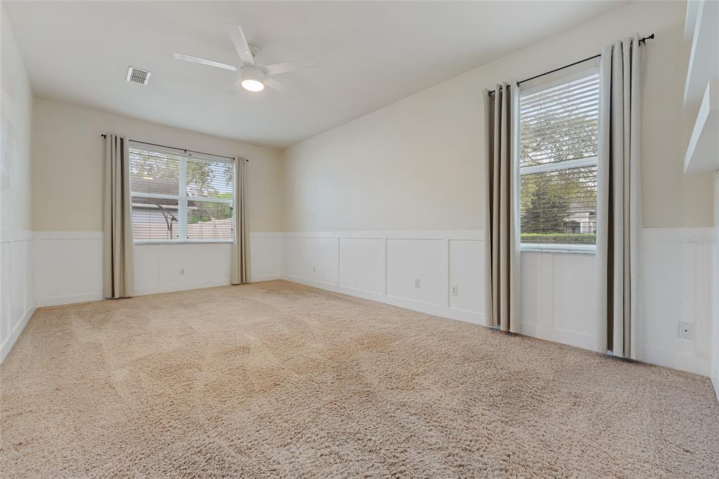 1073 Turtle Lake Court Ocoee, FL 34761 - Photo 29 of 46 an empty room with windows and closet