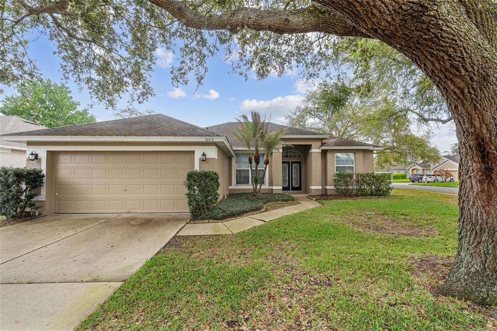 1073 Turtle Lake Court Ocoee, FL 34761 - Photo 4 of 46 front view of a house with a yard