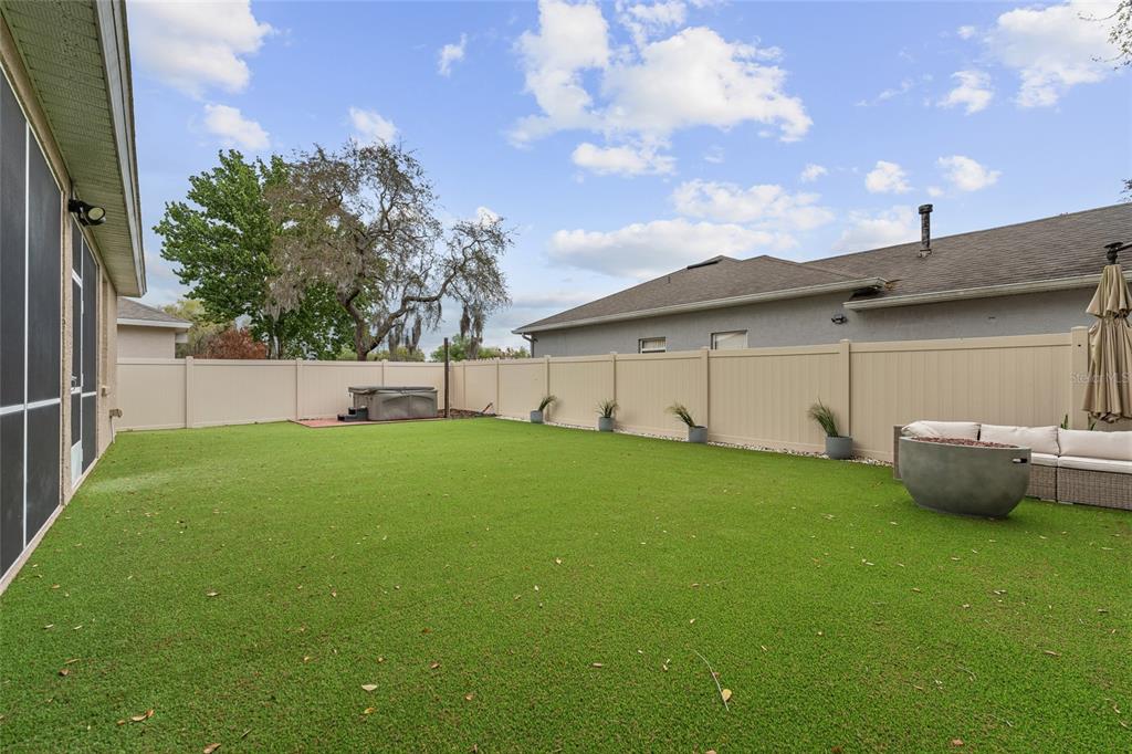 1073 Turtle Lake Court Ocoee, FL 34761 - Photo 8 of 46 a backyard of a house with table and chairs