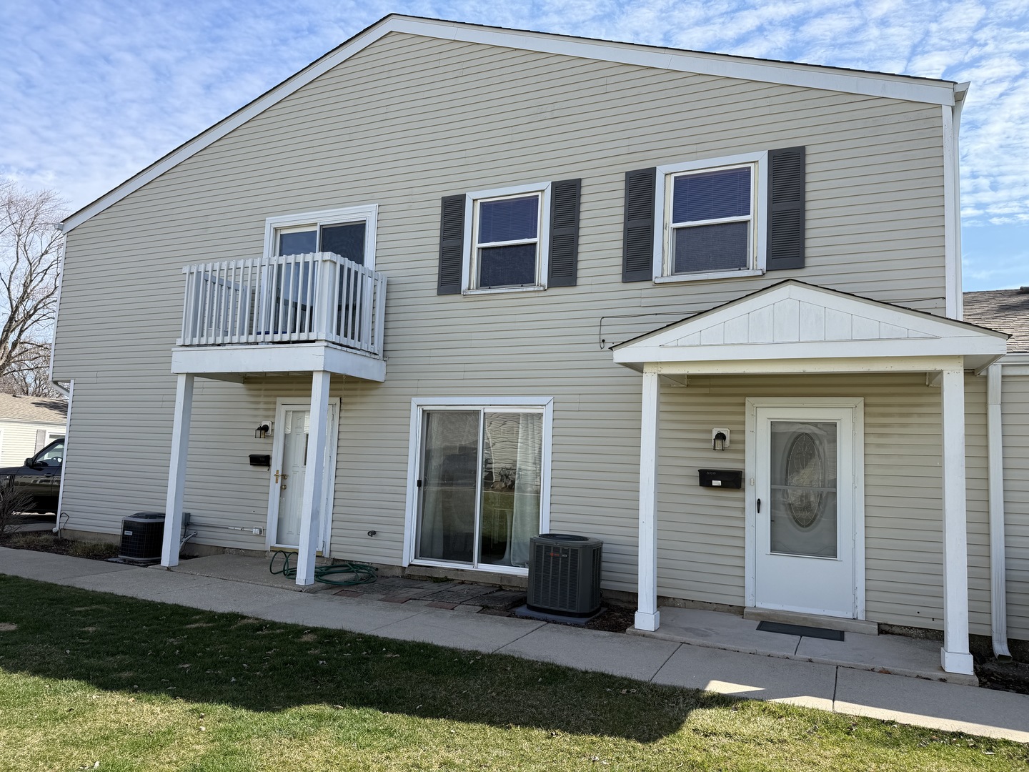 335 David Court, Unit B Bartlett, IL 60103 - Photo 1 of 16 a front view of a house with a yard