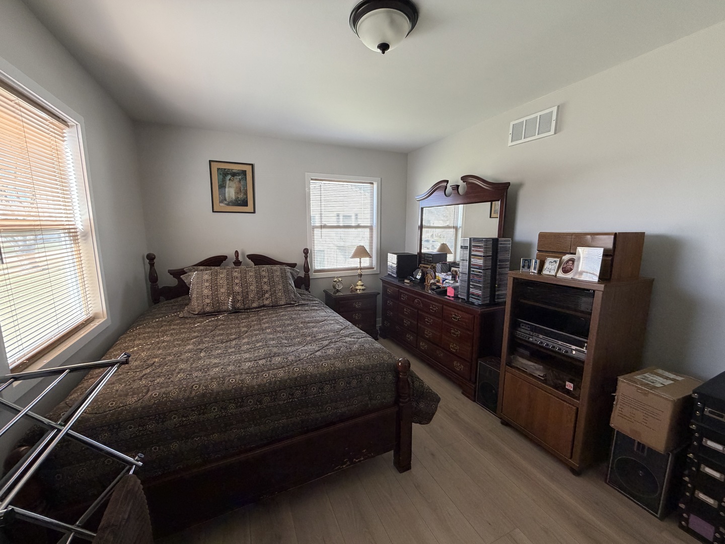 335 David Court, Unit B Bartlett, IL 60103 - Photo 14 of 16 a bedroom with a bed and wooden floor