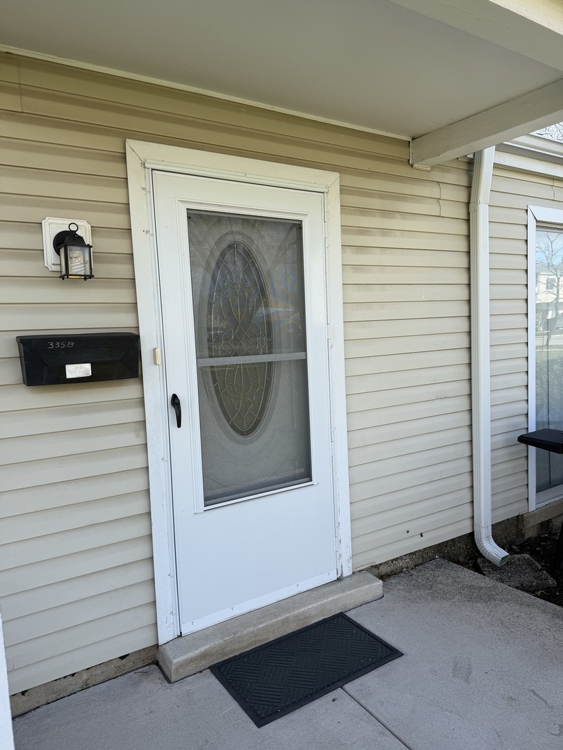 335 David Court, Unit B Bartlett, IL 60103 - Photo 2 of 16 a view of an entryway door