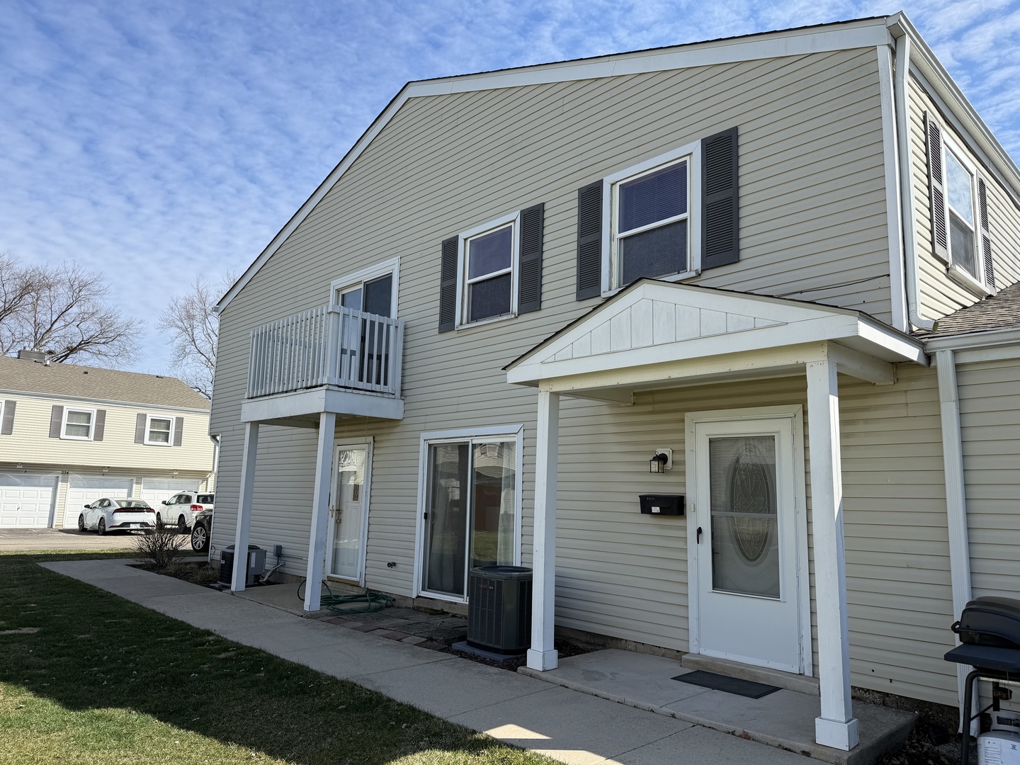 335 David Court, Unit B Bartlett, IL 60103 - Photo 3 of 16 a front view of a house with a yard