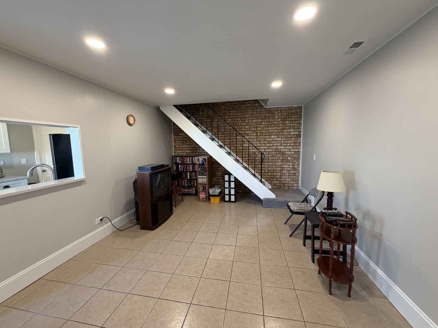 335 David Court, Unit B Bartlett, IL 60103 - Photo 9 of 16 a room with furniture and stairs