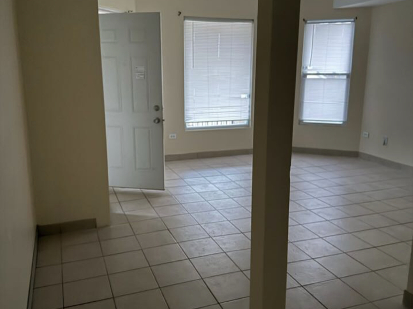 1 South Cagwin Avenue, Unit 1 Joliet, IL 60436 - Photo 3 of 4 a view of an empty room and window