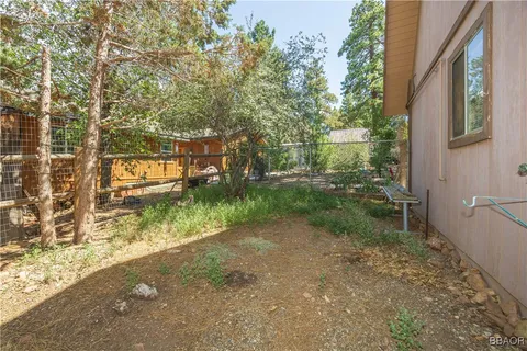 a backyard of a house with lots of green space