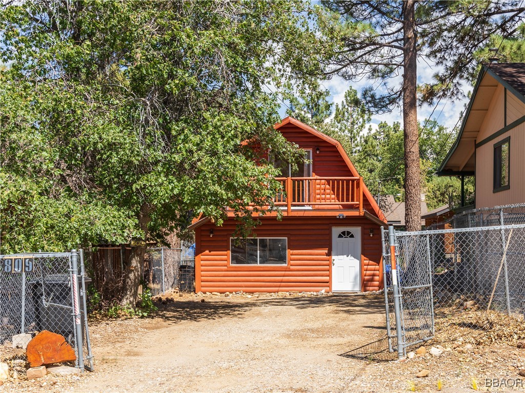 809 San Bernardino Avenue Sugarloaf, CA 92386 - Photo 22 of 23 a view of a house with a yard