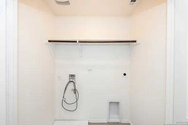 a bathroom with a glass shower door and a shower