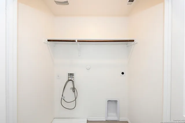 a bathroom with a glass shower door and a shower