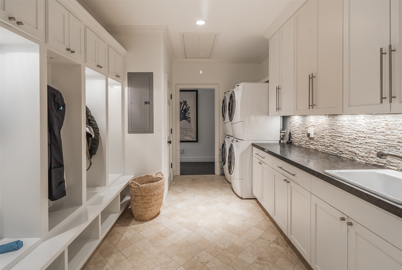 6003 La Flecha Rancho Santa Fe, CA 92067 - Photo 17 of 23 Extra large laundry room with private custom lockers and great storage. Door to outside accesses outdoor shower and pool area. Also, perfect half bath for pool use too.