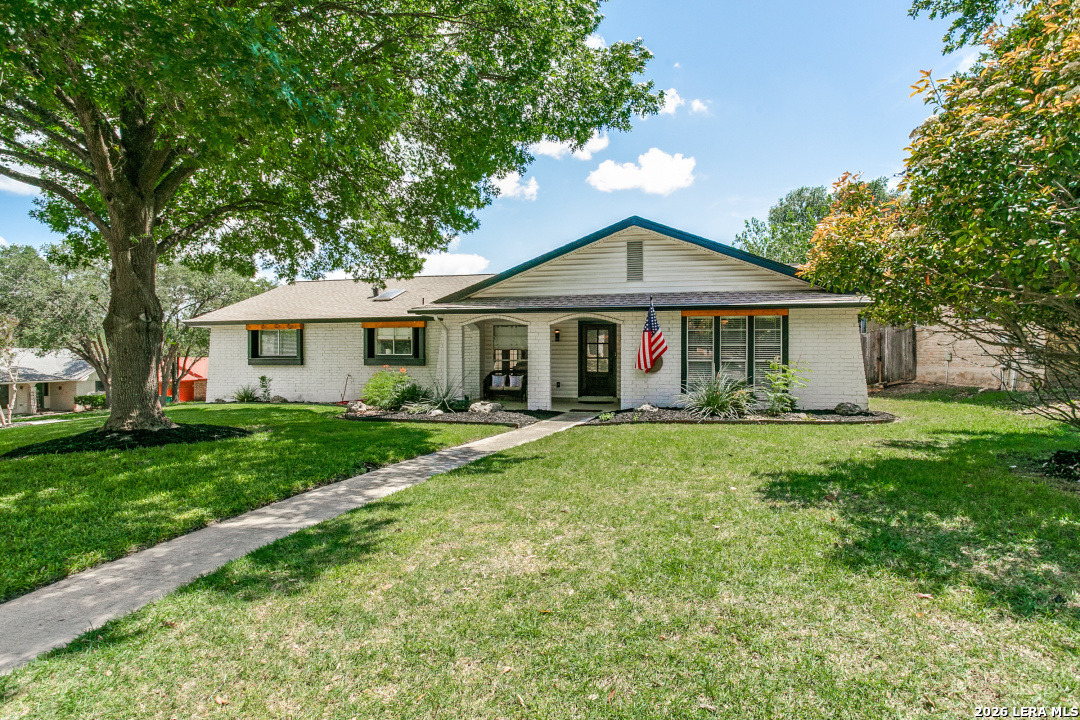 102 Silver Spring Universal City, TX 78148 - Photo 35 of 36 a front view of a house with a garden