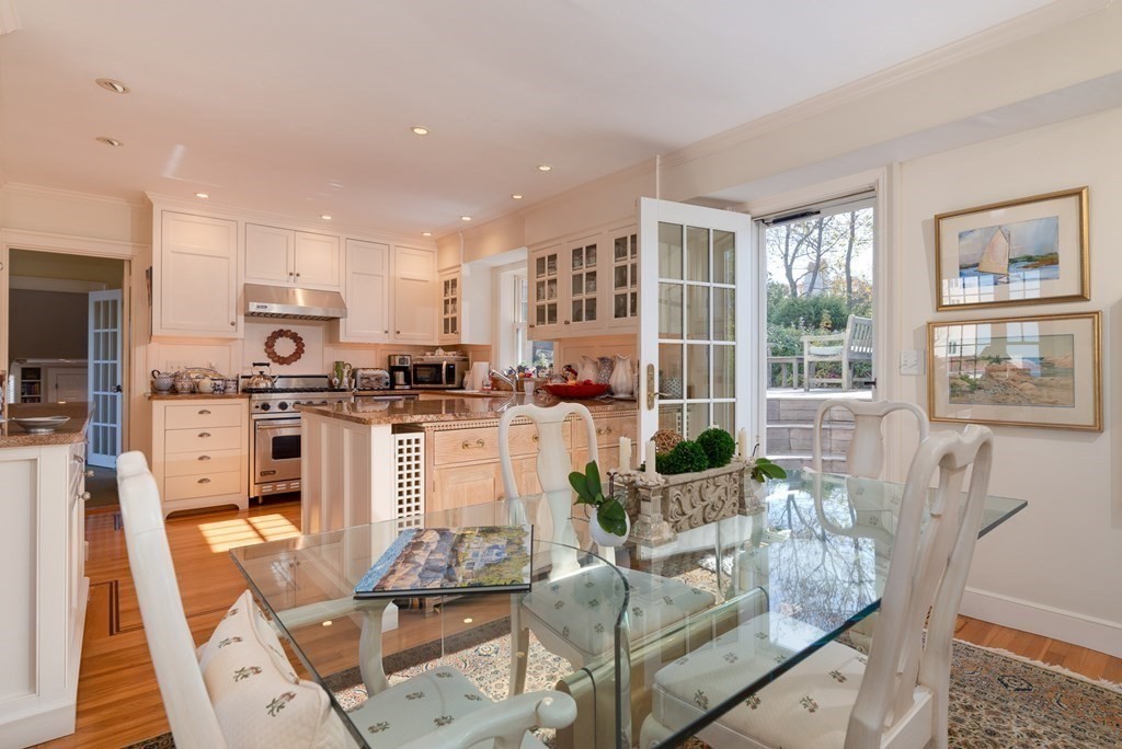 363 Jerusalem Road Cohasset, MA 02025 - Photo 24 of 42 a living room with stainless steel appliances furniture a rug and a kitchen view