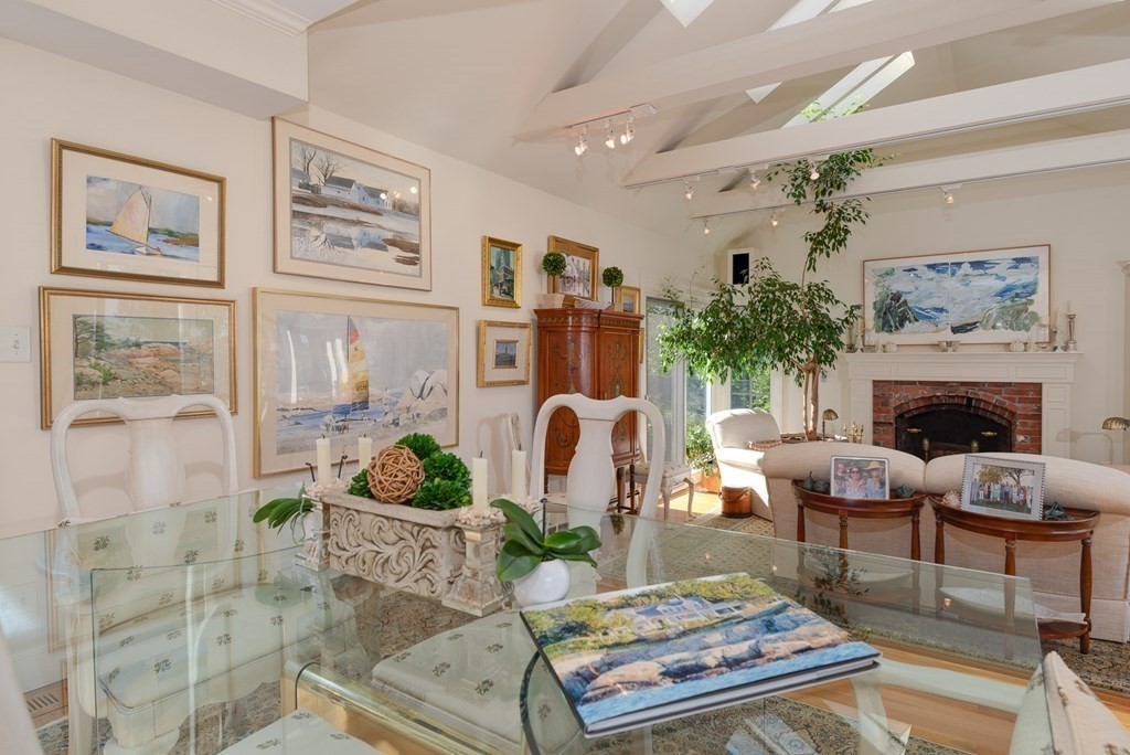363 Jerusalem Road Cohasset, MA 02025 - Photo 25 of 42 a living room with furniture potted plant and a fireplace