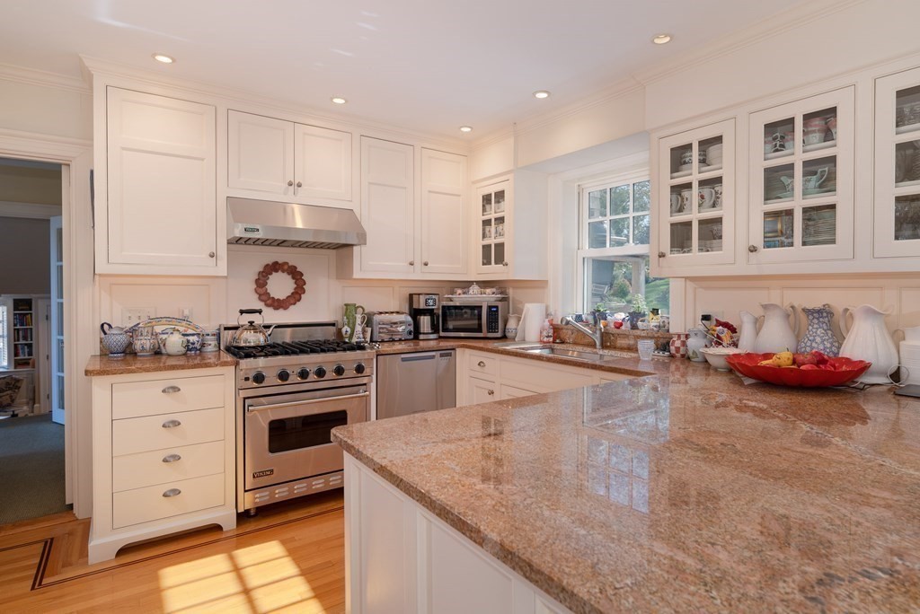 363 Jerusalem Road Cohasset, MA 02025 - Photo 27 of 42 a kitchen with stainless steel appliances granite countertop a stove and cabinets