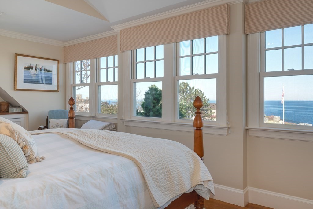 363 Jerusalem Road Cohasset, MA 02025 - Photo 30 of 42 a bedroom with a large bed and a large window
