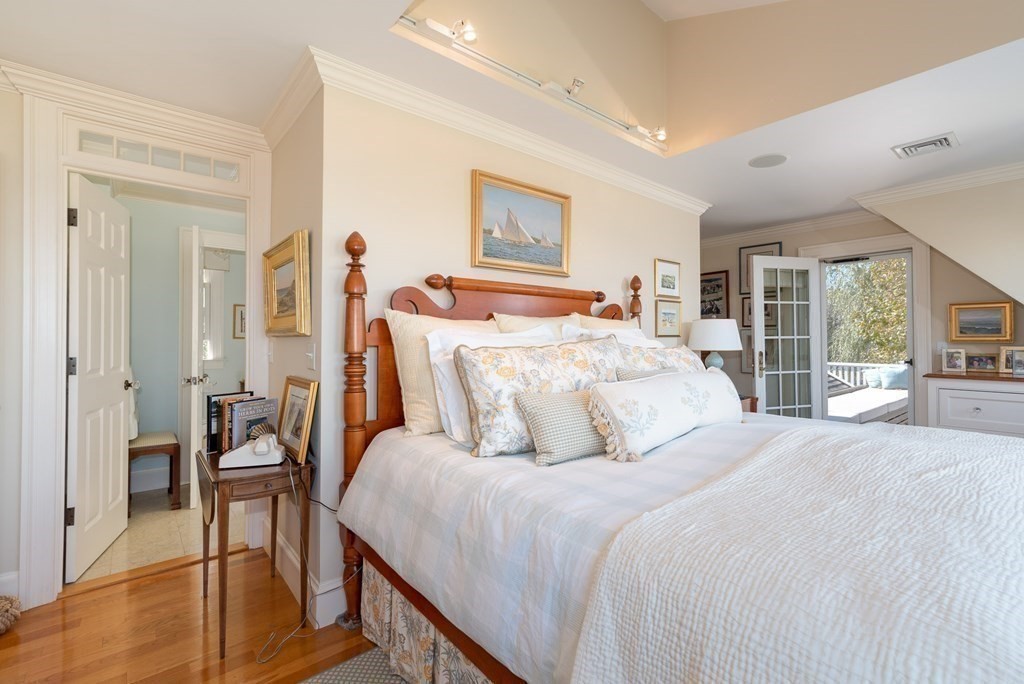 363 Jerusalem Road Cohasset, MA 02025 - Photo 31 of 42 a bedroom with a bed and wooden floor