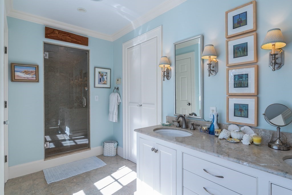 363 Jerusalem Road Cohasset, MA 02025 - Photo 33 of 42 a spacious bathroom with a granite countertop sink and a mirror
