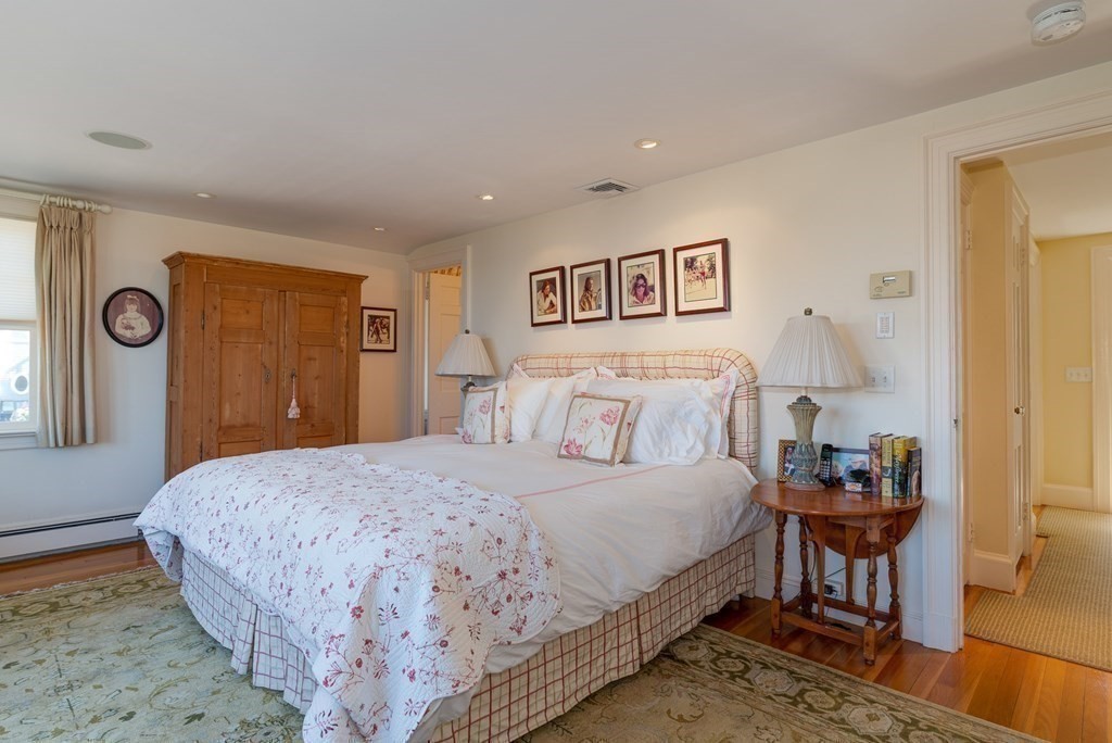363 Jerusalem Road Cohasset, MA 02025 - Photo 34 of 42 a bedroom with a bed and a table in it