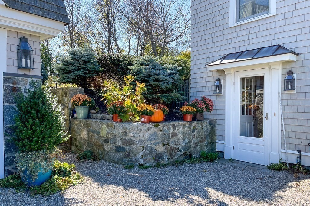 363 Jerusalem Road Cohasset, MA 02025 - Photo 10 of 42 a front view of a house with a yard and potted plants