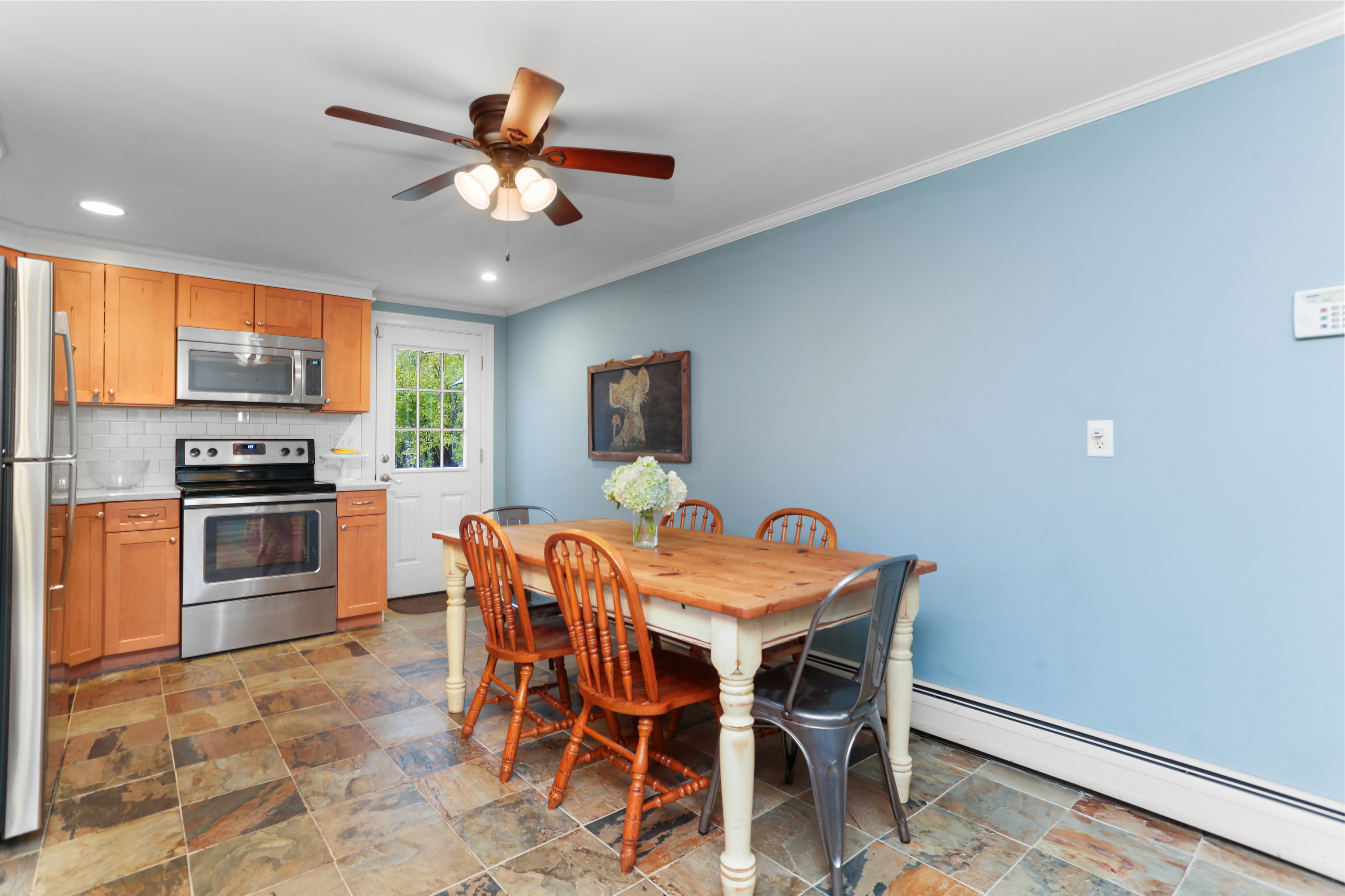 101 Soundview Avenue Fairfield, CT 06825 - Photo 11 of 40 a view of a dining room with furniture and chandelier