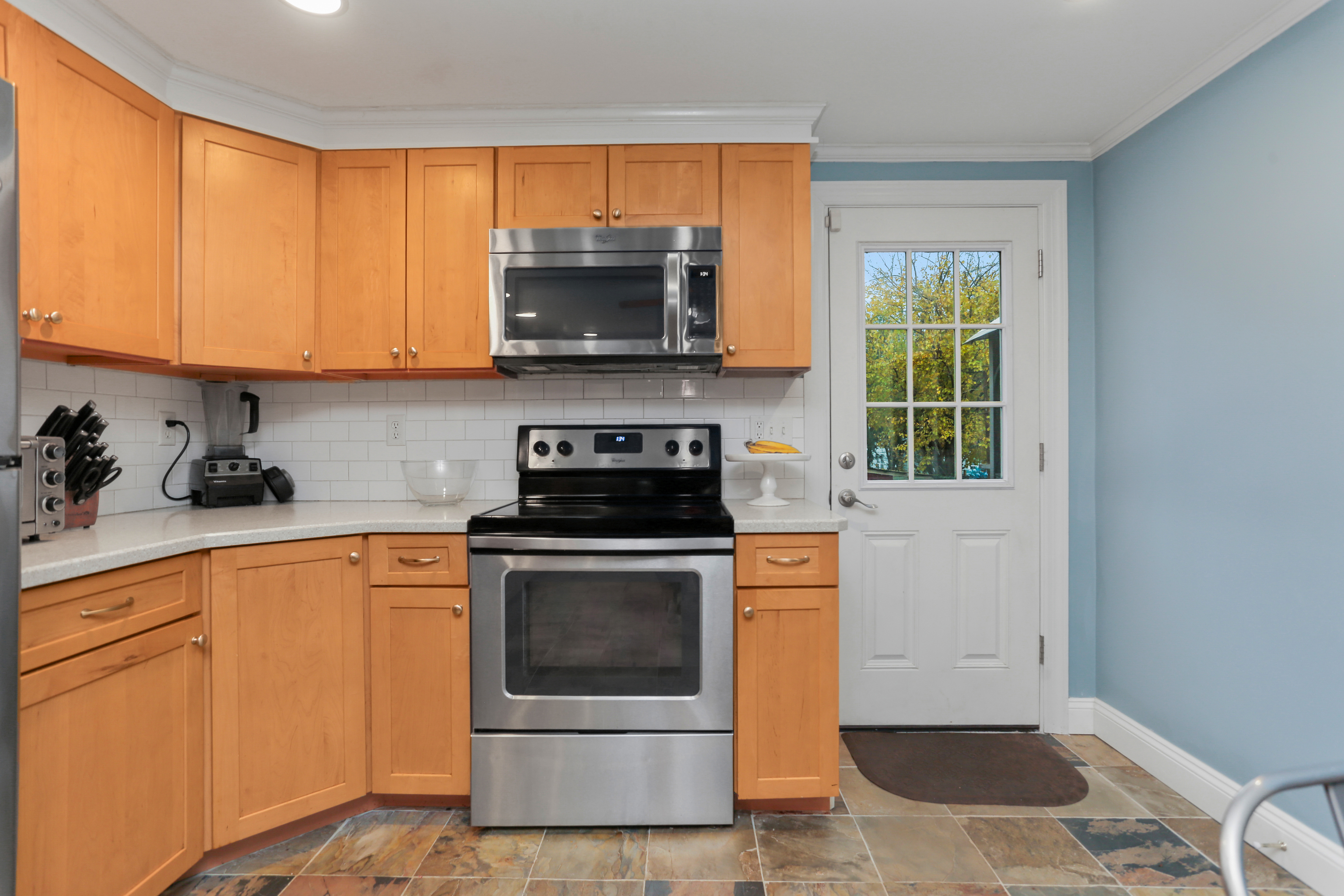 101 Soundview Avenue Fairfield, CT 06825 - Photo 12 of 40 a kitchen with a stove a sink and a microwave