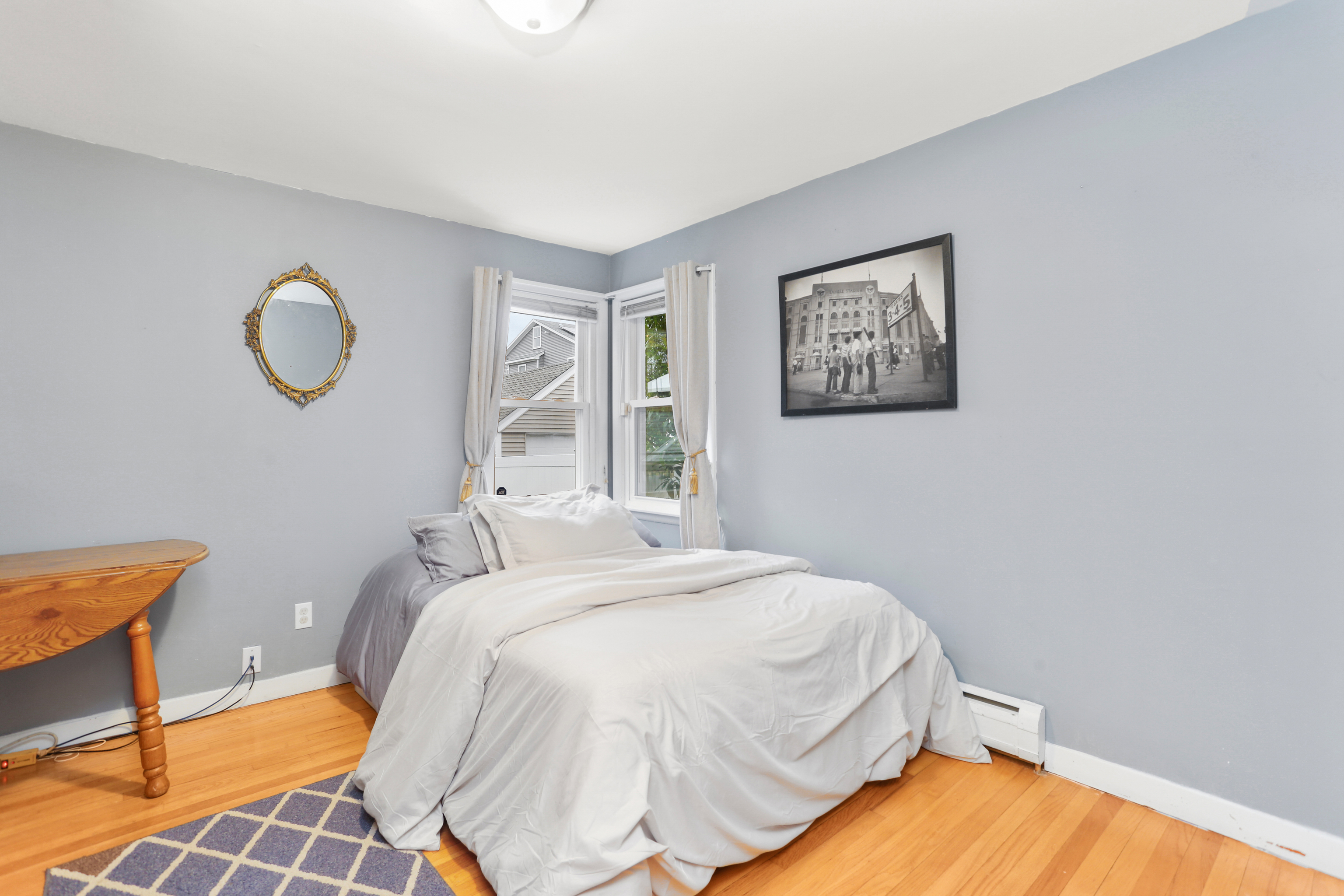 101 Soundview Avenue Fairfield, CT 06825 - Photo 14 of 40 a bedroom with a bed and window