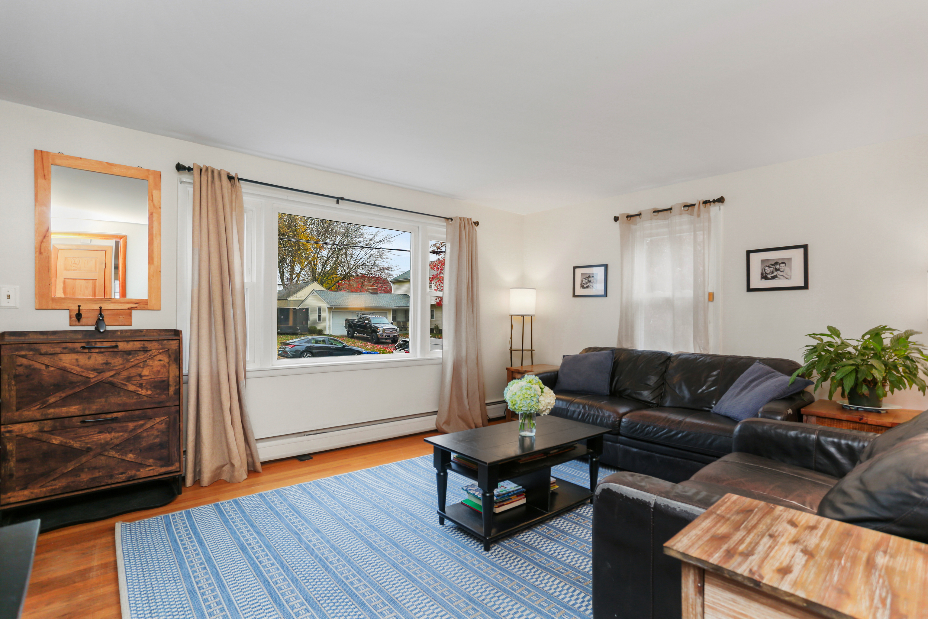 101 Soundview Avenue Fairfield, CT 06825 - Photo 3 of 40 a living room with furniture and a wooden floor