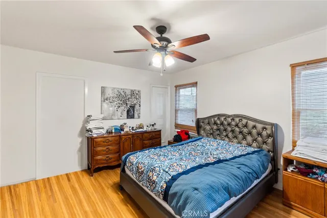 a bedroom with a bed and dresser
