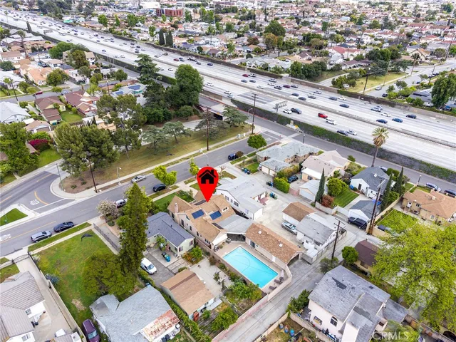 an aerial view of residential houses with outdoor space