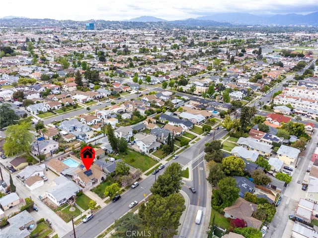 an aerial view of residential houses with outdoor space