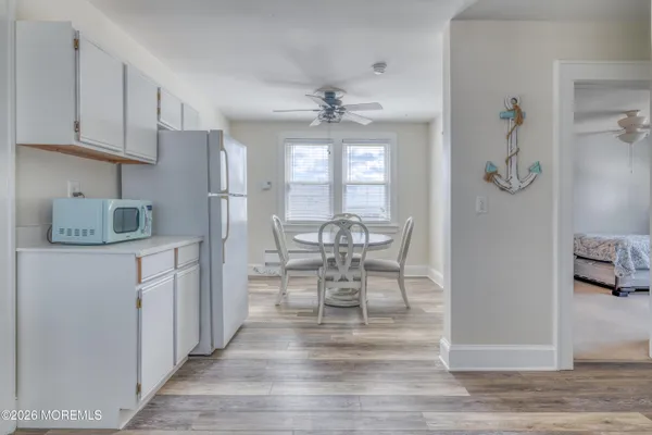 a kitchen with granite countertop cabinets stainless steel appliances a sink and a window