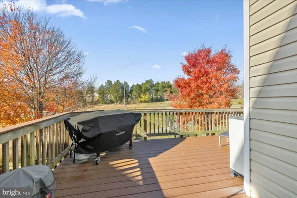 a balcony with wooden floor and fence