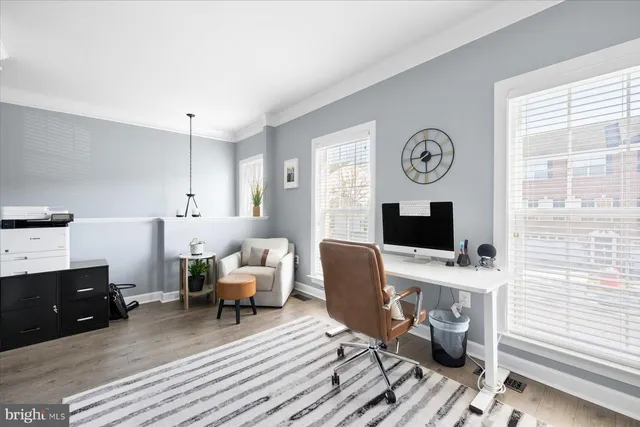 a workspace with furniture and window