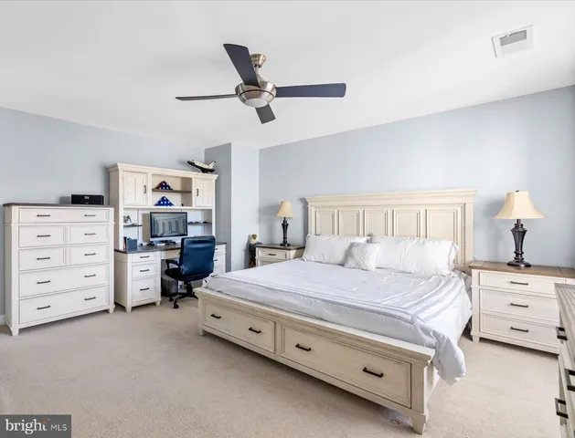 a bedroom with a bed and furniture