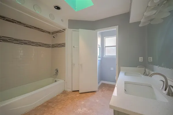 a bathroom with a sink and a bathtub
