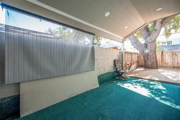 a view of backyard with patio