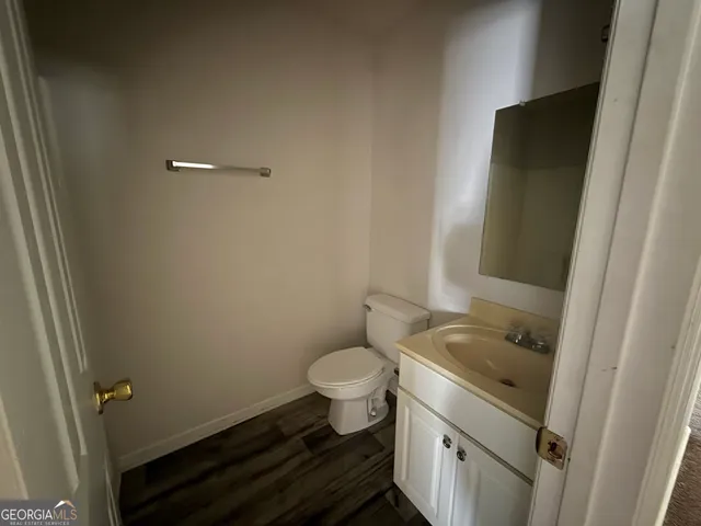 a bathroom with a sink and toilet