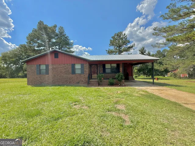 a front view of a house with yard