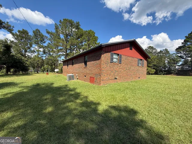 a backyard of a house with lots of green space