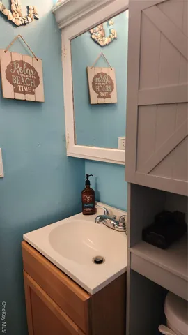 a close view of a sink and a stove in a kitchen