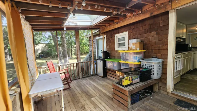 a view of living room with furniture and wooden floor